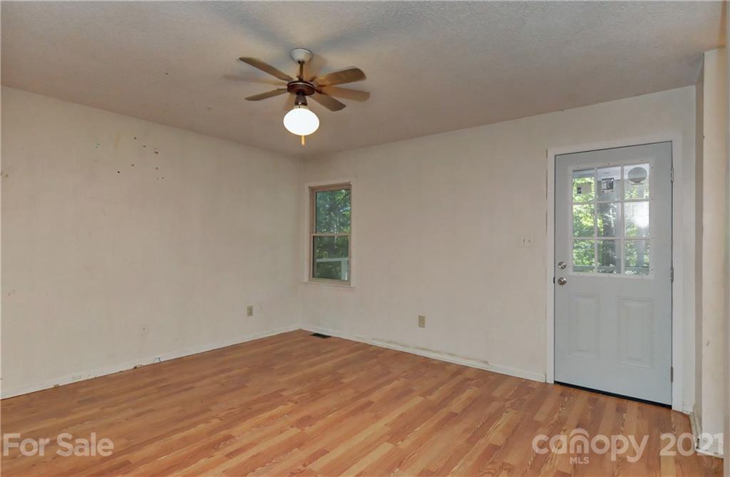 3621 Austin Road Monroe, NC 28112 - Photo 20 of 28 wooden floor in an empty room with a window