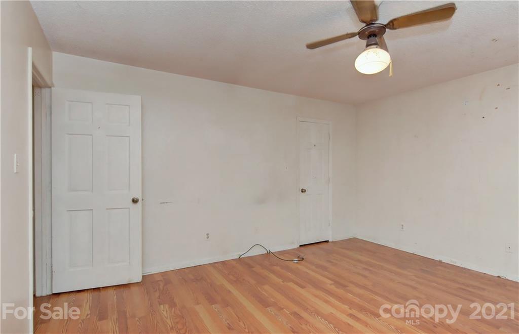 3621 Austin Road Monroe, NC 28112 - Photo 21 of 28 a view of empty room with wooden floor