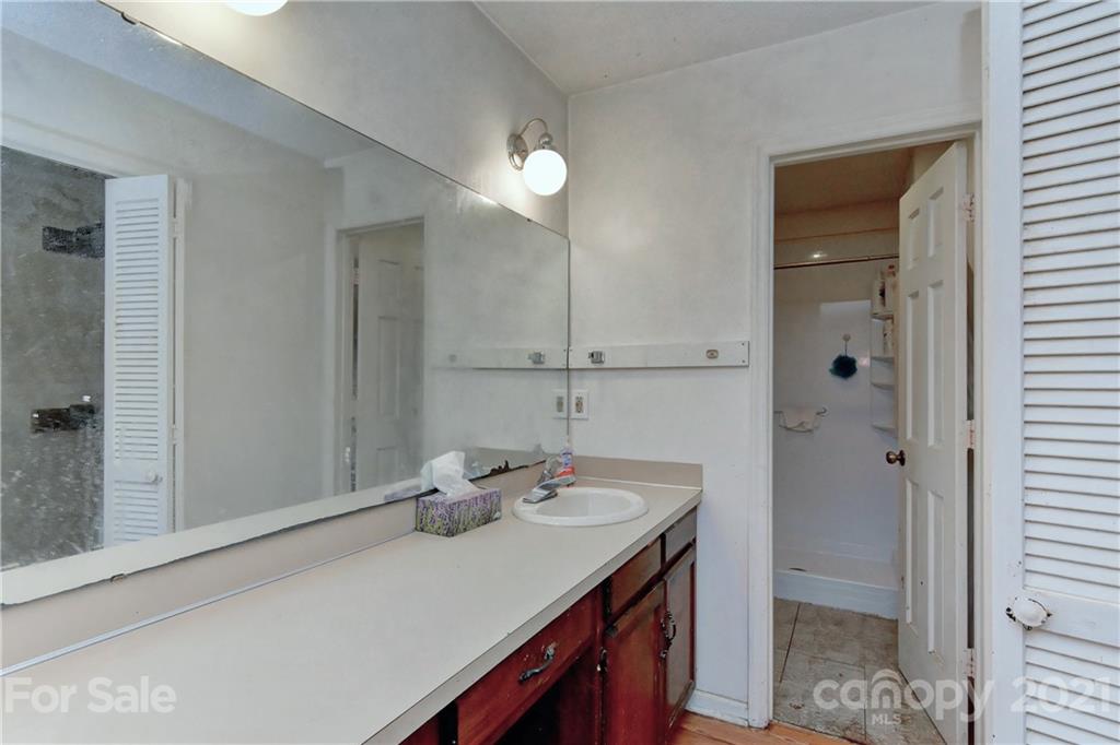 3621 Austin Road Monroe, NC 28112 - Photo 22 of 28 a bathroom with a sink vanity and a mirror