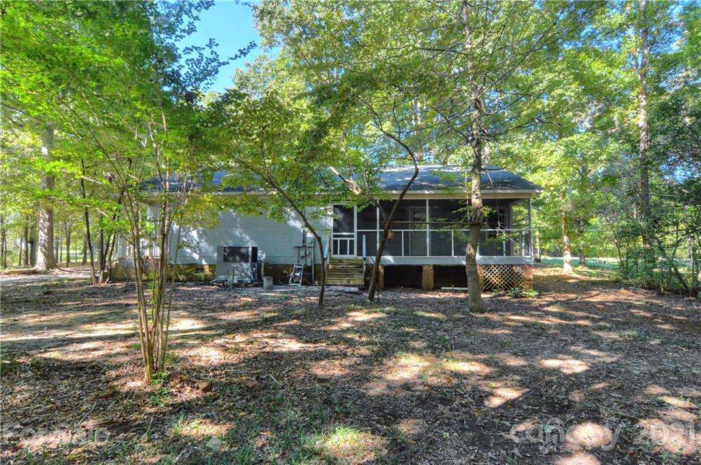 3621 Austin Road Monroe, NC 28112 - Photo 27 of 28 a view of a house with a large tree and a yard