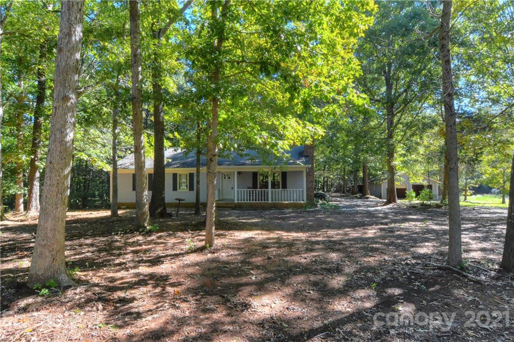 3621 Austin Road Monroe, NC 28112 - Photo 4 of 28 a view of a tree in the backyard of a house