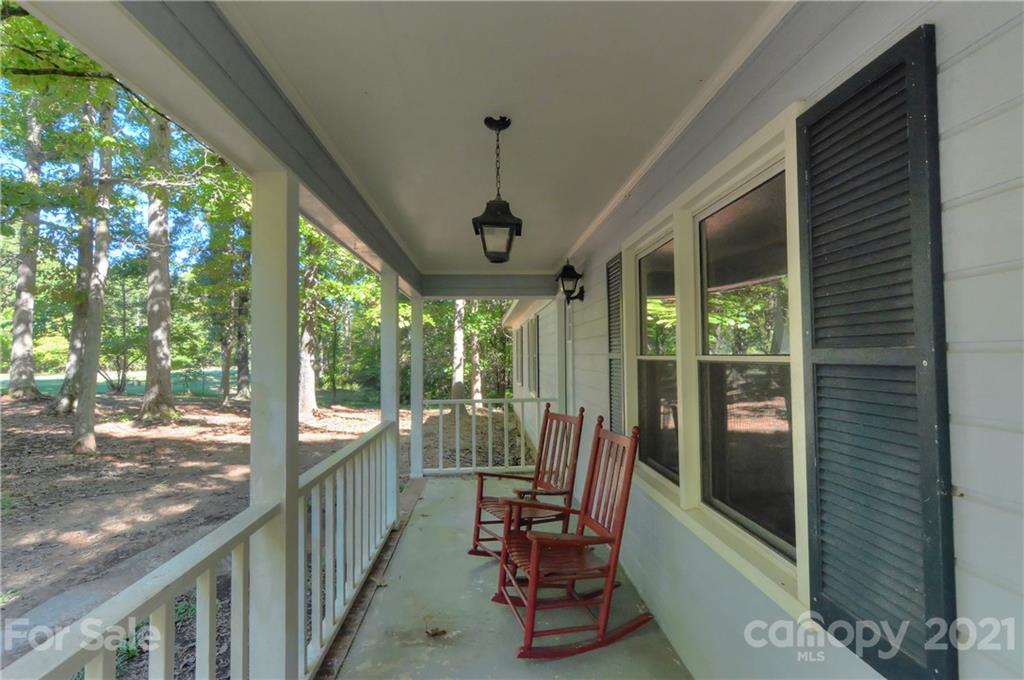 3621 Austin Road Monroe, NC 28112 - Photo 5 of 28 a view of a porch with chairs and backyard