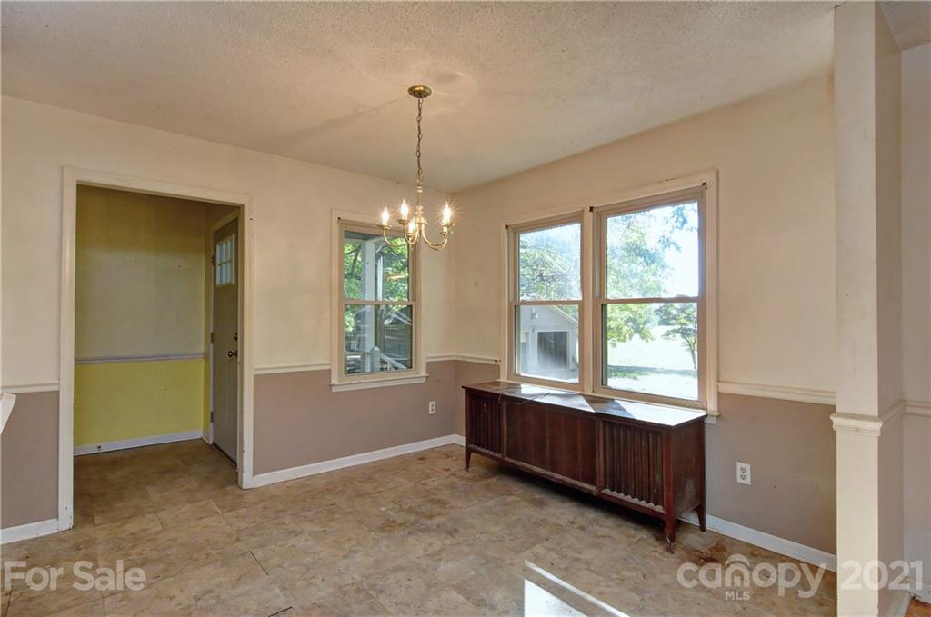 3621 Austin Road Monroe, NC 28112 - Photo 8 of 28 a view of an empty room with window and cabinet area