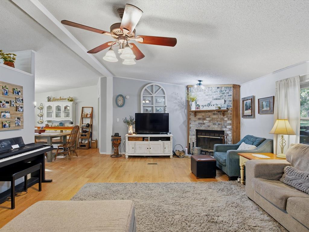 3275 Finis Road Graham, TX 76450 - Photo 7 of 36 a living room with furniture and a flat screen tv