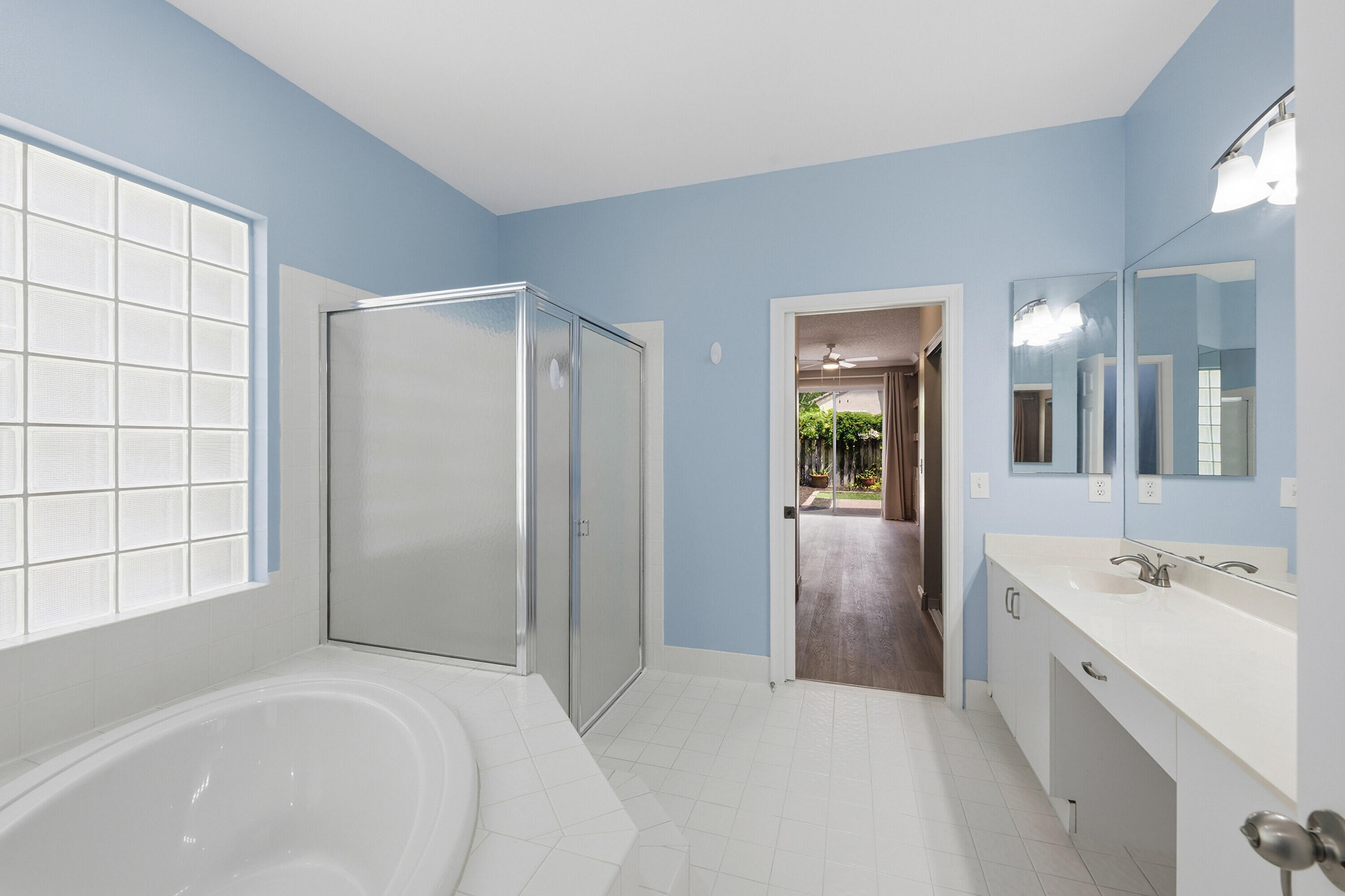 18474 Old Princeton Lane Boca Raton, FL 33498 - Photo 26 of 46 a bathroom with a tub sink and mirror
