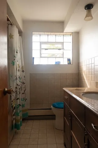 a room with window and shower