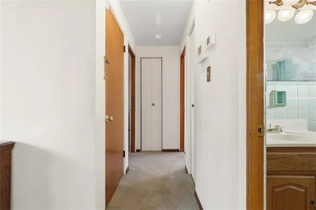 a view of a bathroom from the hallway