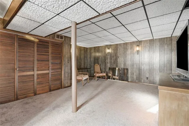 a view of a livingroom with furniture and a garage