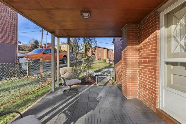 a view of a porch with wooden floor