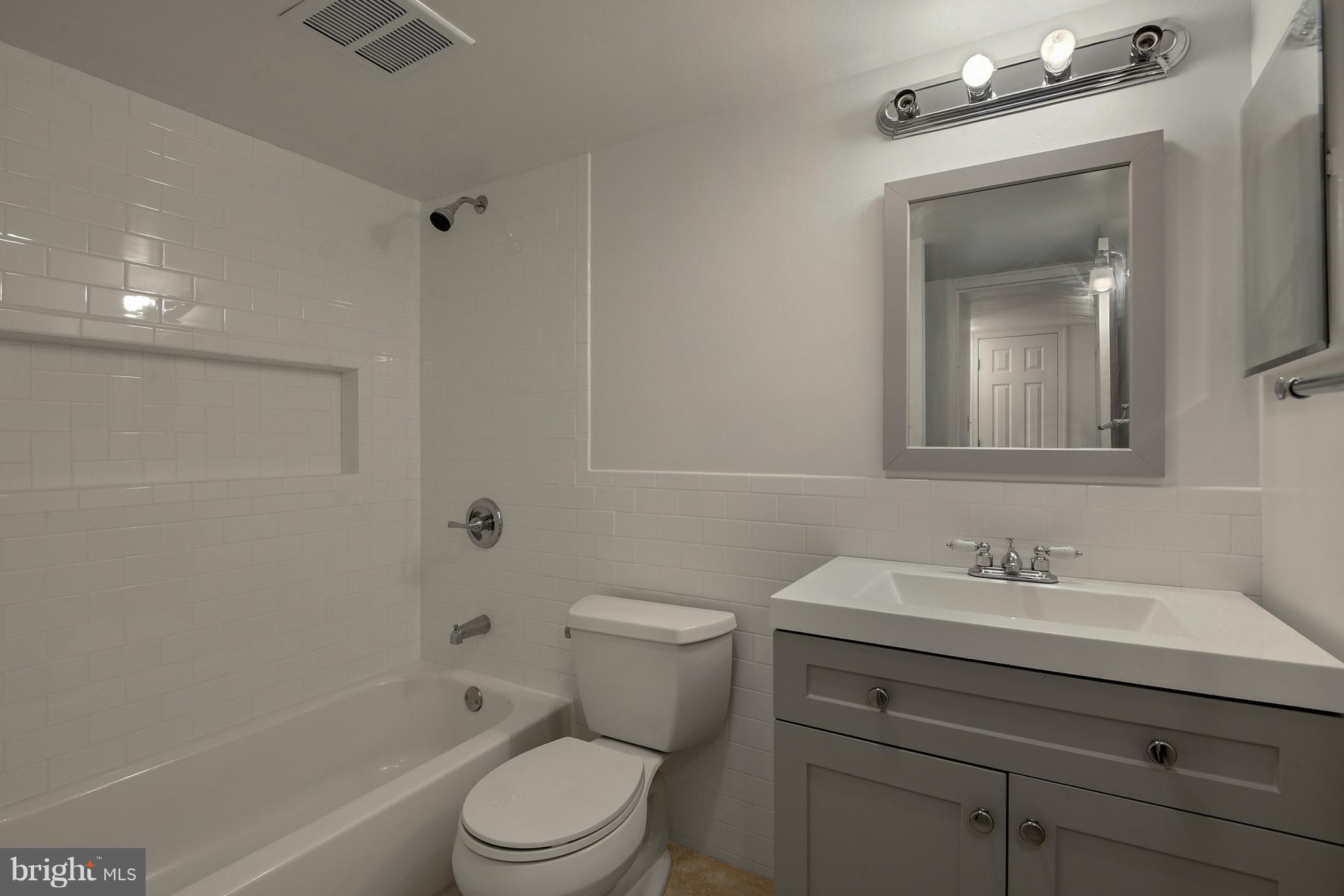 3224 Spartan Road, Unit 3E6 Olney, MD 20832 - Photo 11 of 27 a bathroom with a sink toilet a vanity and shower