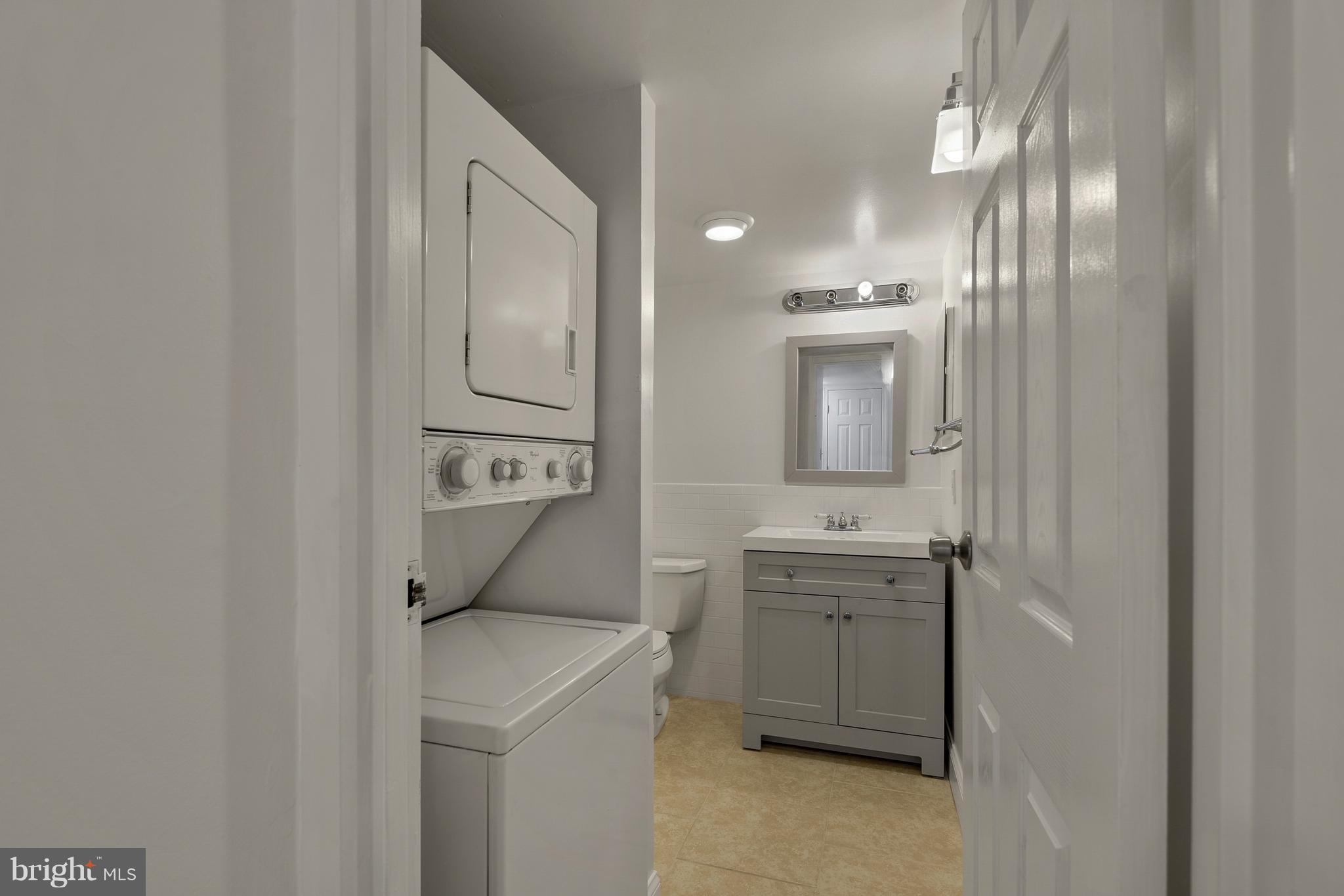 3224 Spartan Road, Unit 3E6 Olney, MD 20832 - Photo 12 of 27 a bathroom with a sink a toilet and mirror