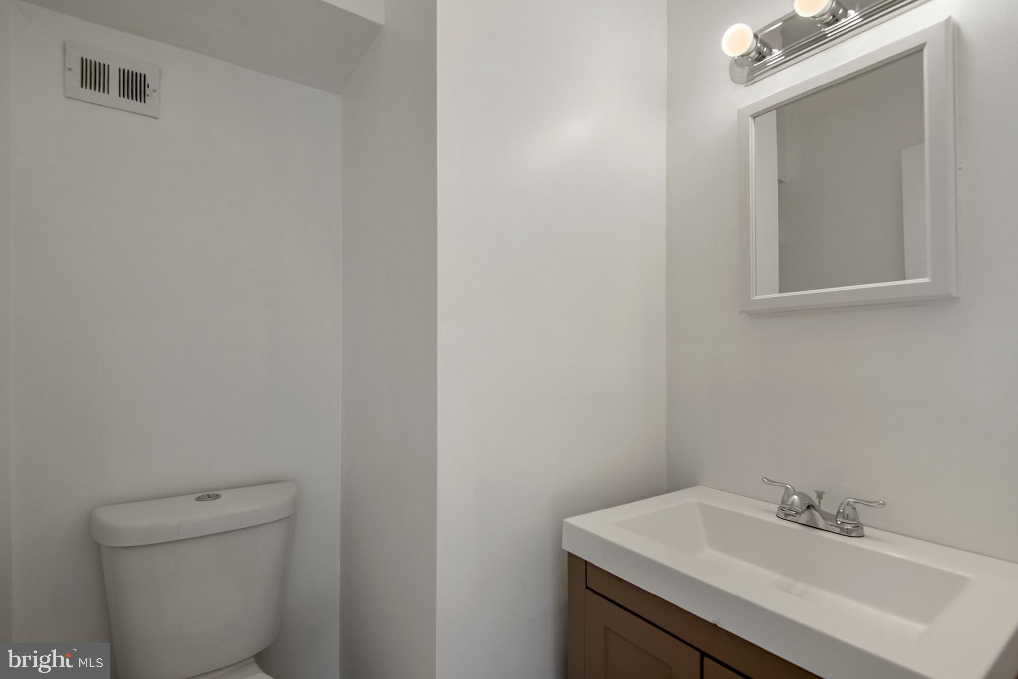 3224 Spartan Road, Unit 3E6 Olney, MD 20832 - Photo 13 of 27 a bathroom with a sink toilet and mirror