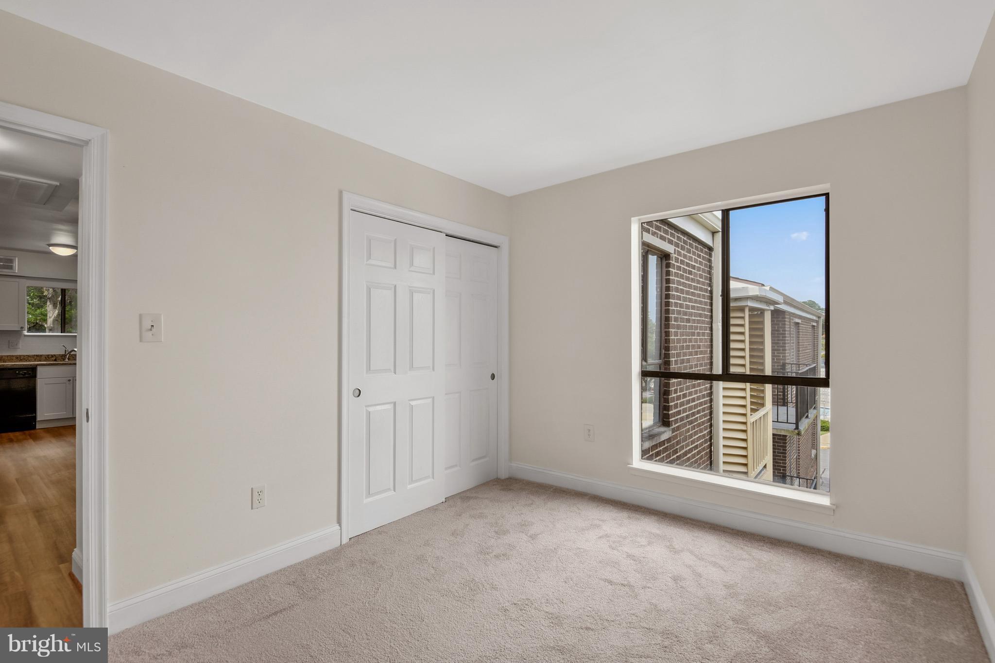 3224 Spartan Road, Unit 3E6 Olney, MD 20832 - Photo 22 of 27 an empty room with windows and closet