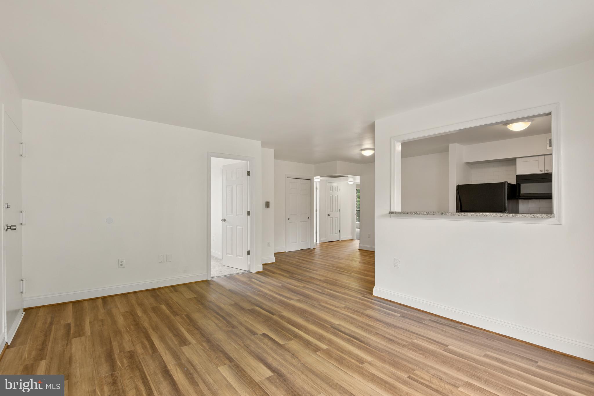 3224 Spartan Road, Unit 3E6 Olney, MD 20832 - Photo 9 of 27 a view of empty room with wooden floor and a sink