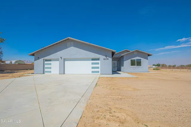 a front view of a house with yard