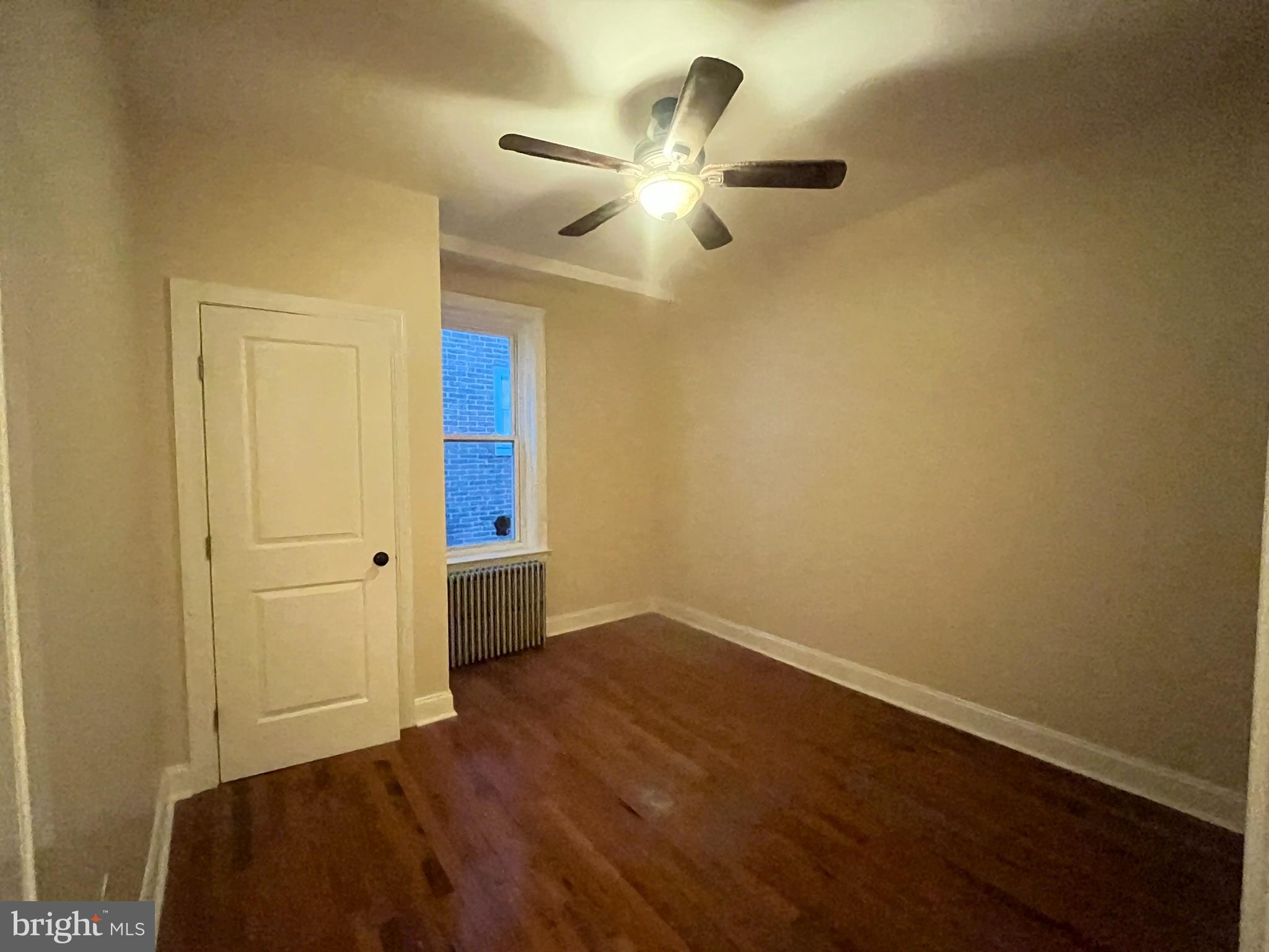 4946 Walnut Street, Unit 2F Philadelphia, PA 19139 - Photo 13 of 20 wooden floor in an empty room