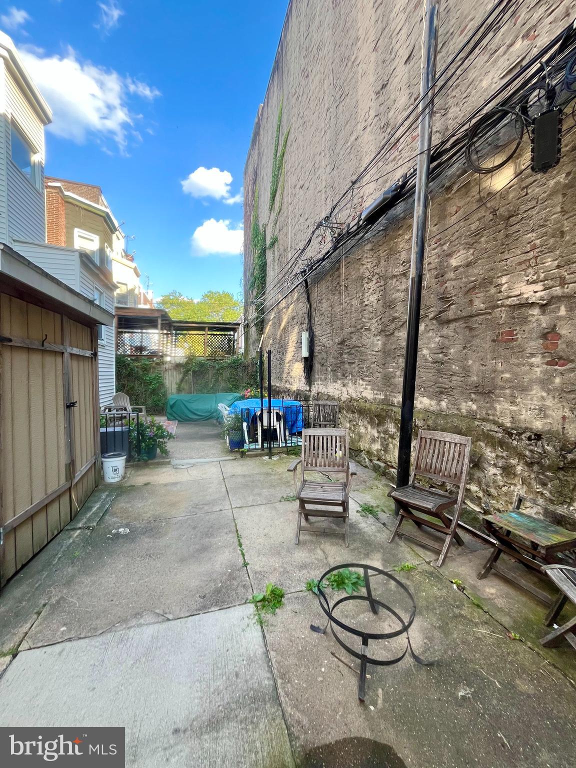 4946 Walnut Street, Unit 2F Philadelphia, PA 19139 - Photo 15 of 20 a backyard of a house with sitting area