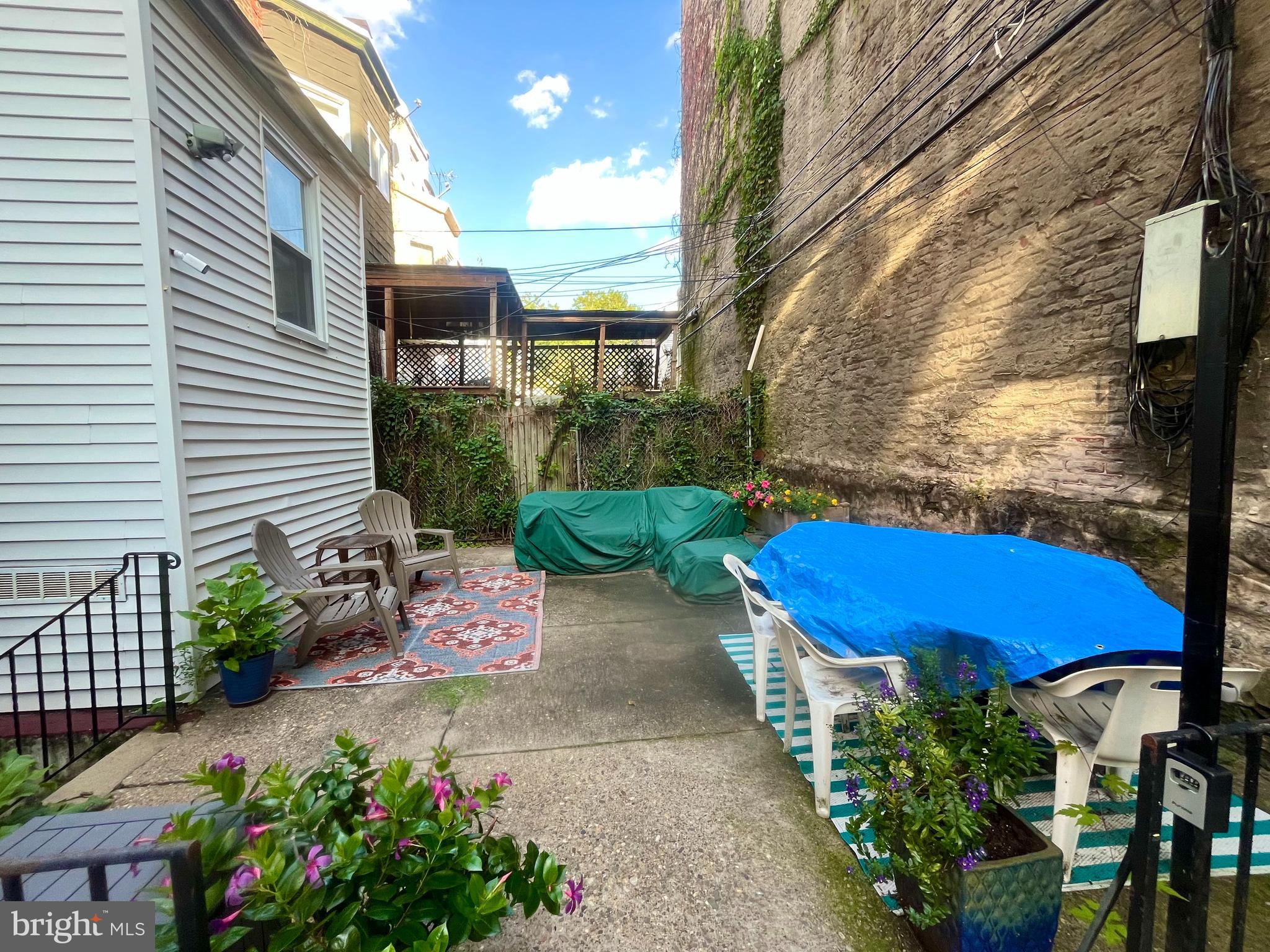 4946 Walnut Street, Unit 2F Philadelphia, PA 19139 - Photo 16 of 20 a view of a backyard with sitting area