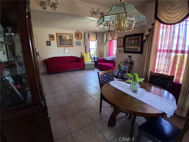 a view of a livingroom with furniture window and wooden floor