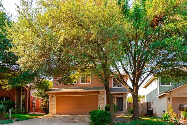 a view of house with yard
