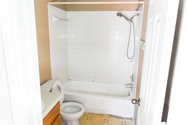 a view of staircase with white walls