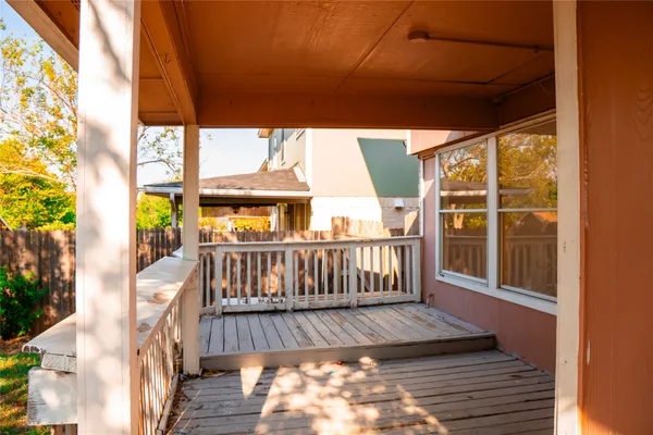 a view of a backyard with tree