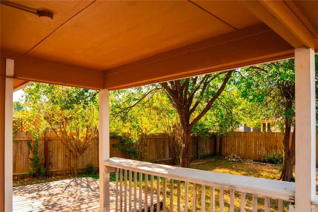 a view of a backyard with tree