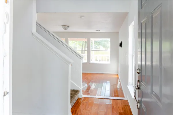 a view of front door with wooden floor