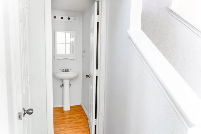 a kitchen with a sink stove and refrigerator