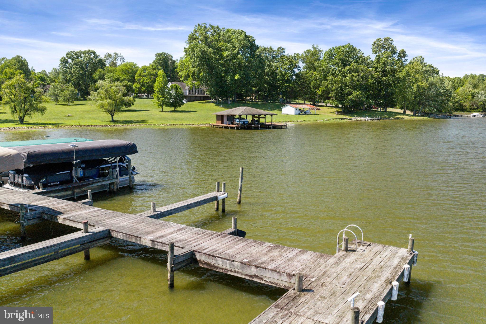 161 Troy Road Louisa, VA 23093 - Photo 54 of 60 a view of a lake with couches chairs