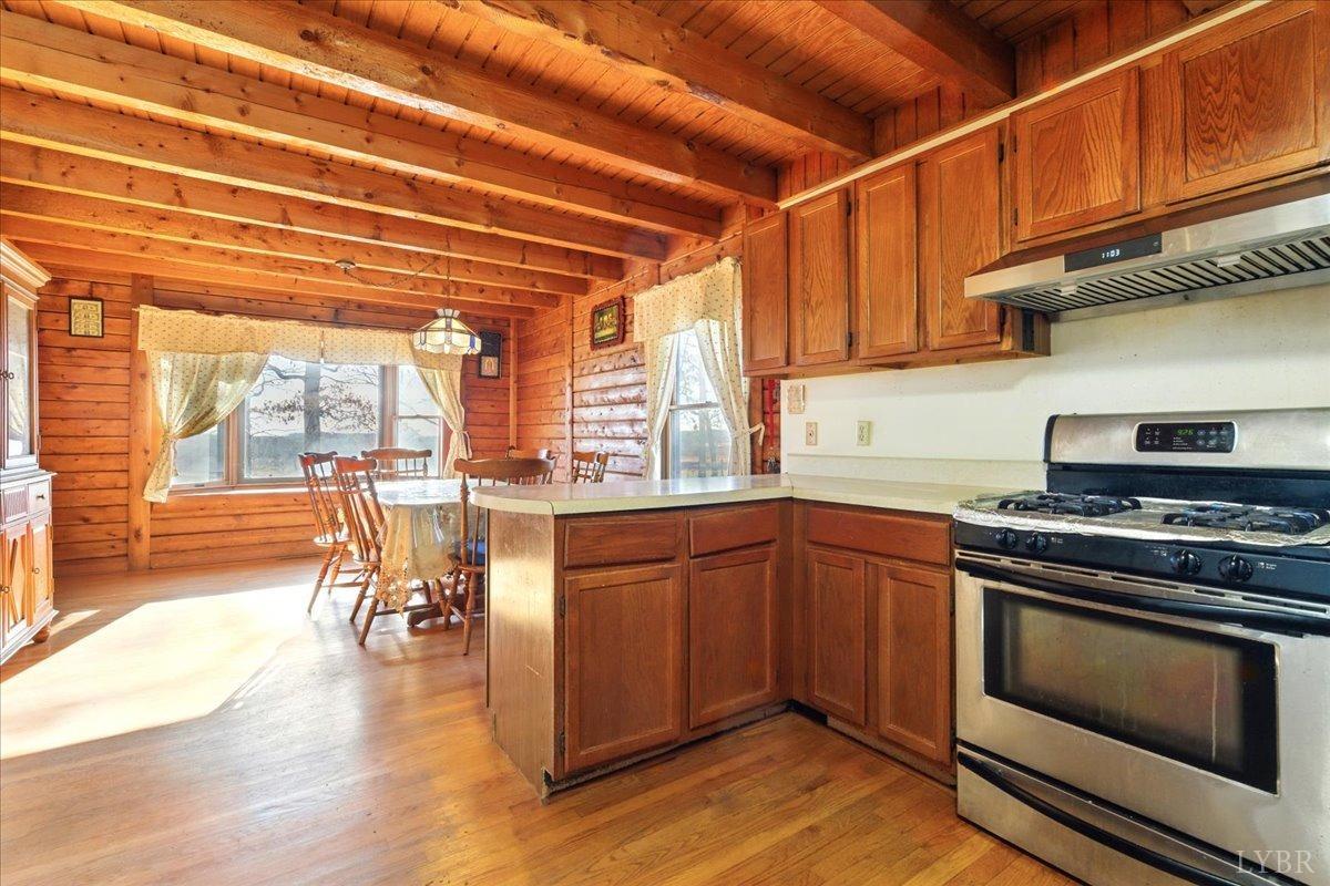 2192 Hixburg Road Pamplin, VA 23958 - Photo 6 of 31 a kitchen with stainless steel appliances granite countertop a stove and a wooden floors