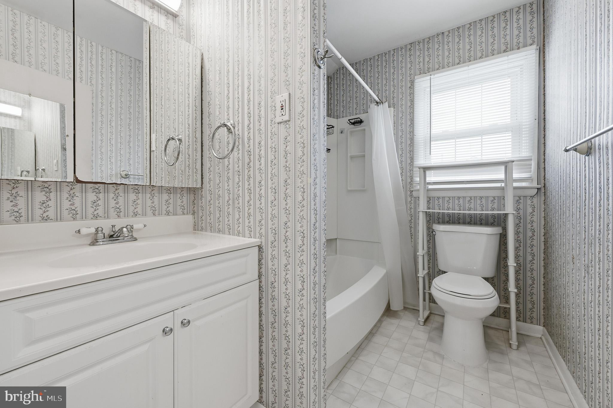 406 Blackstone Road Newark, DE 19713 - Photo 11 of 27 a bathroom with a sink a toilet and shower