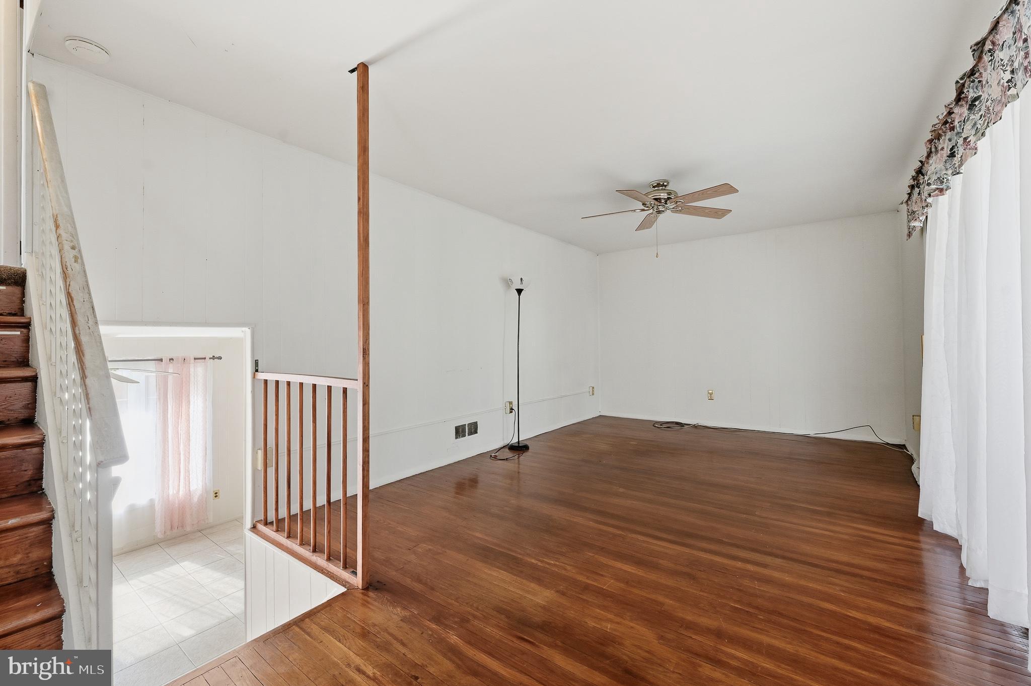 406 Blackstone Road Newark, DE 19713 - Photo 13 of 27 a view of a room with wooden floor fan and windows