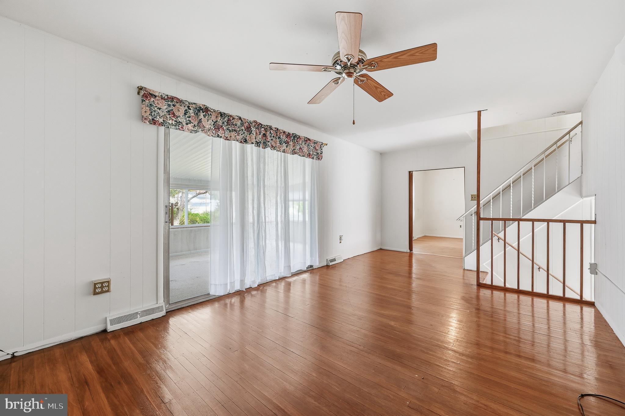 406 Blackstone Road Newark, DE 19713 - Photo 15 of 27 a view of an empty room with wooden floor and a window