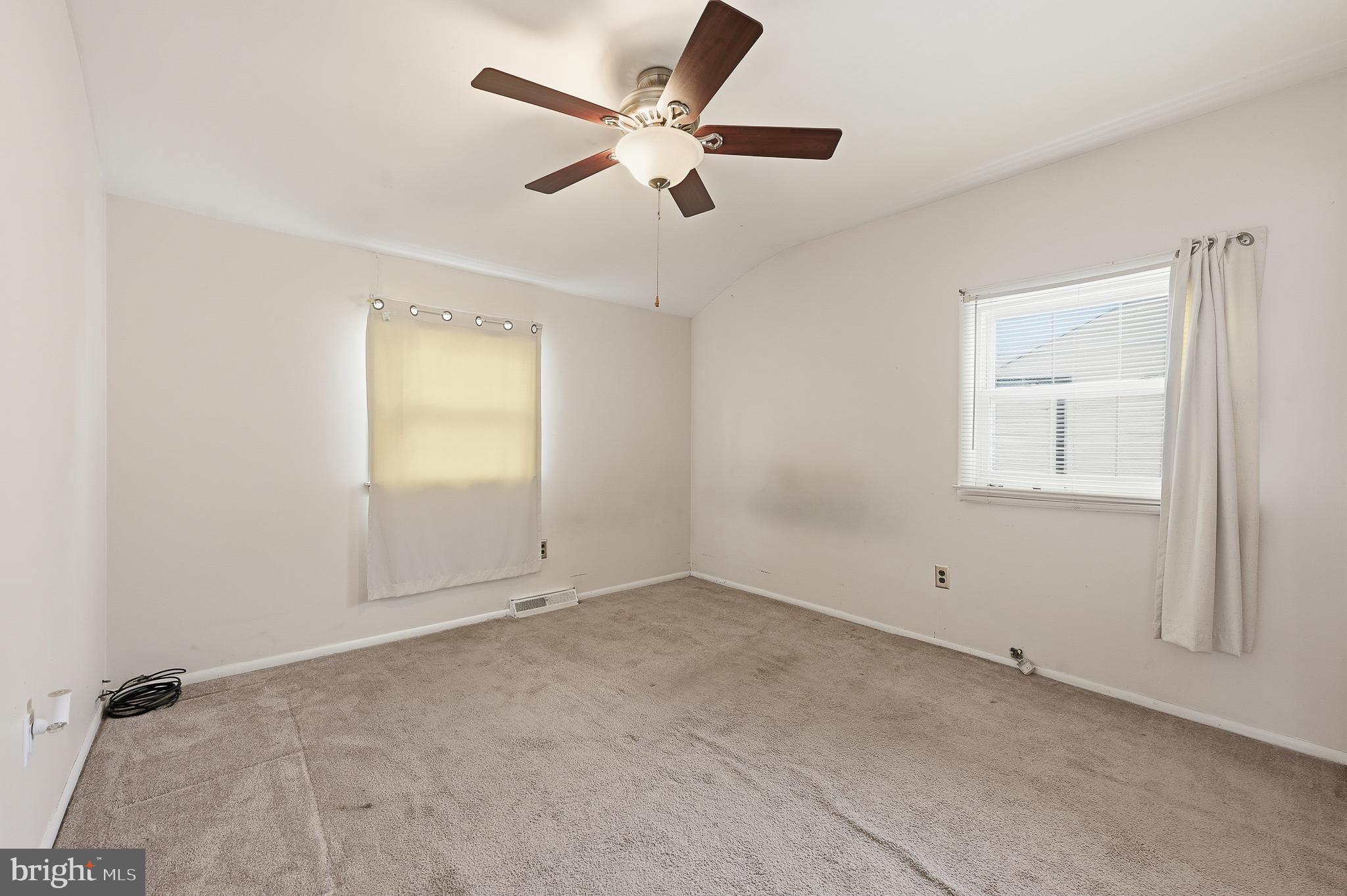 406 Blackstone Road Newark, DE 19713 - Photo 22 of 27 an empty room with a window and a fan