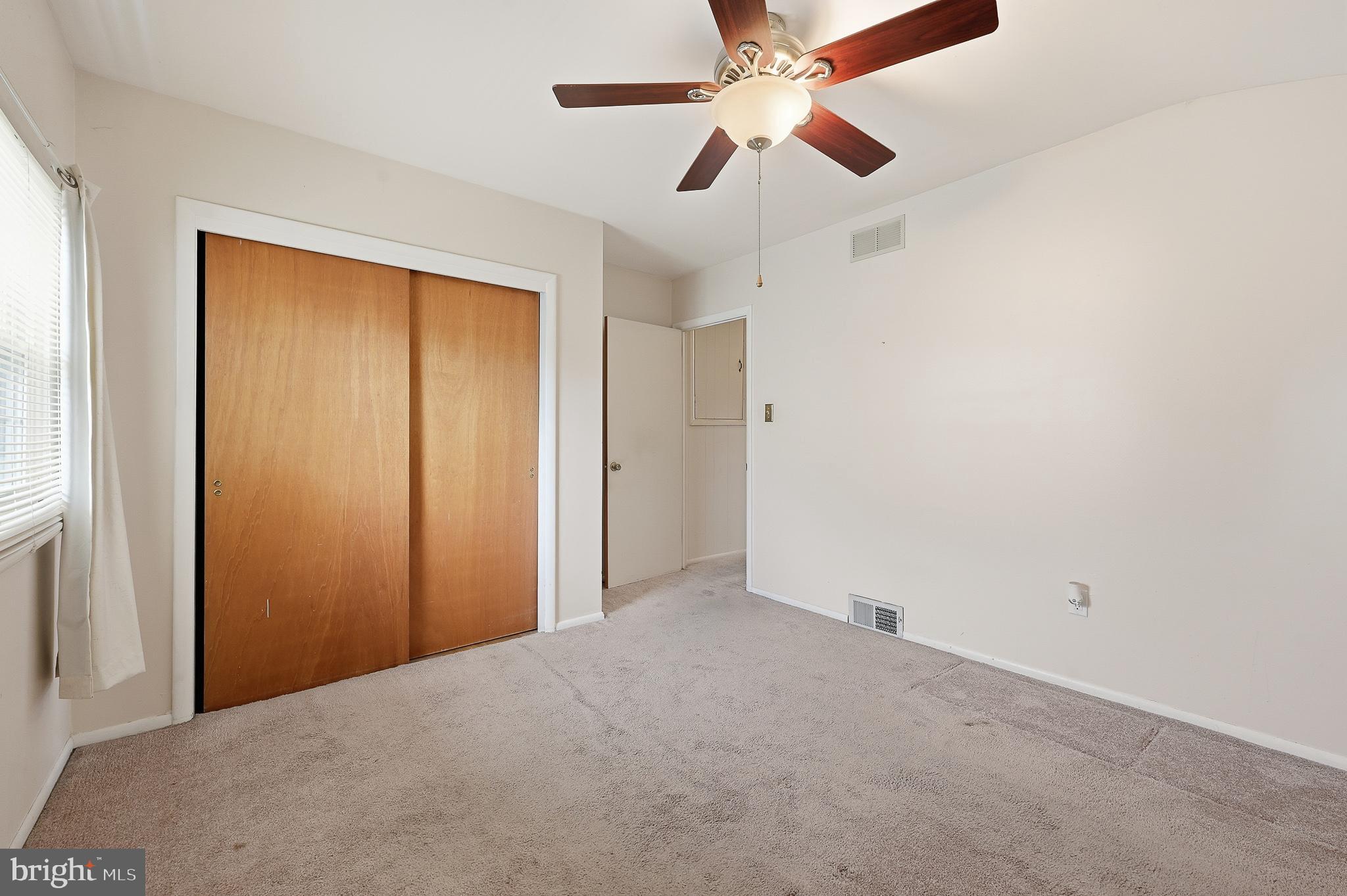 406 Blackstone Road Newark, DE 19713 - Photo 23 of 27 an empty room with closet and a chandelier fan