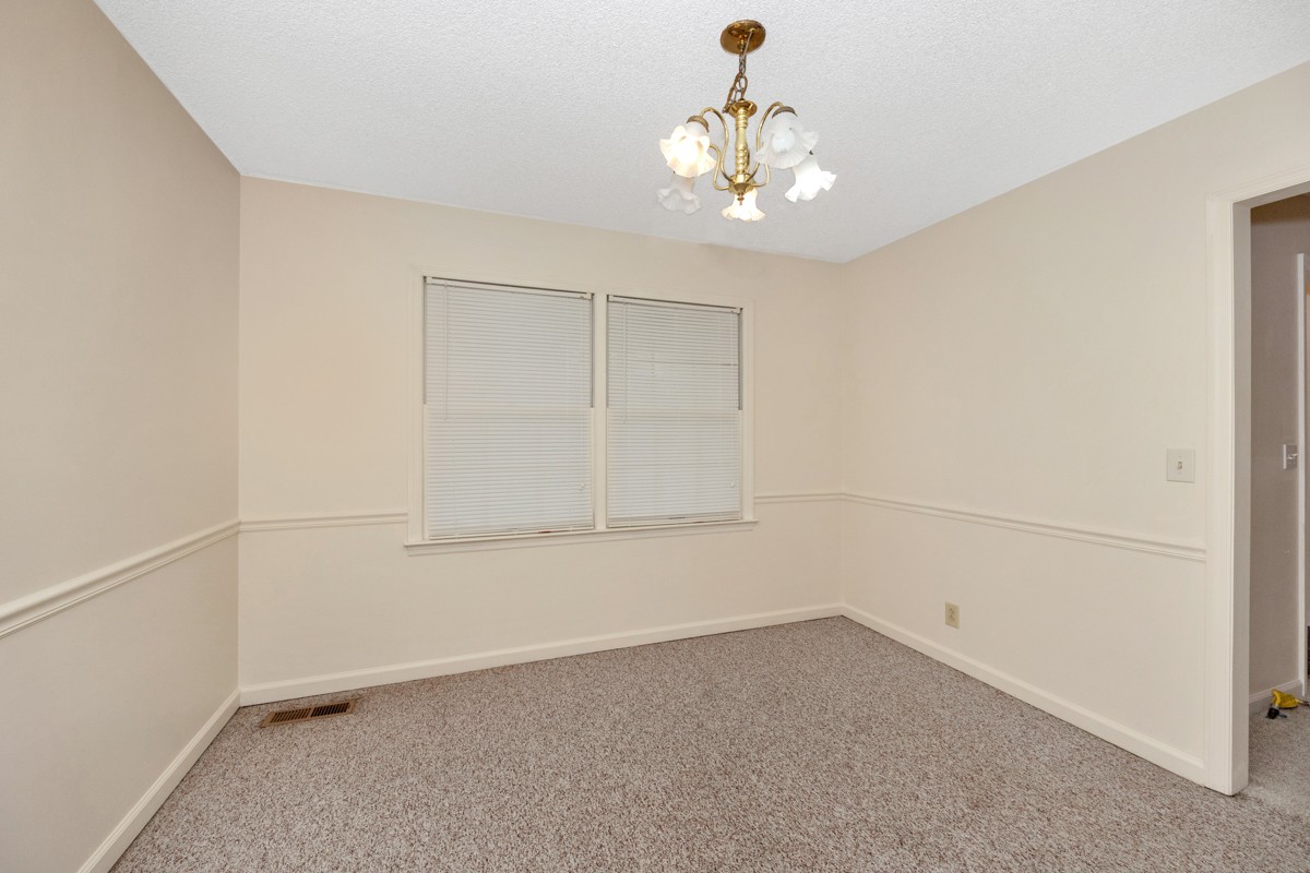 2134 Ready Section Road Toney, AL 35773 - Photo 16 of 35 an empty room with a empty space and a ceiling fan