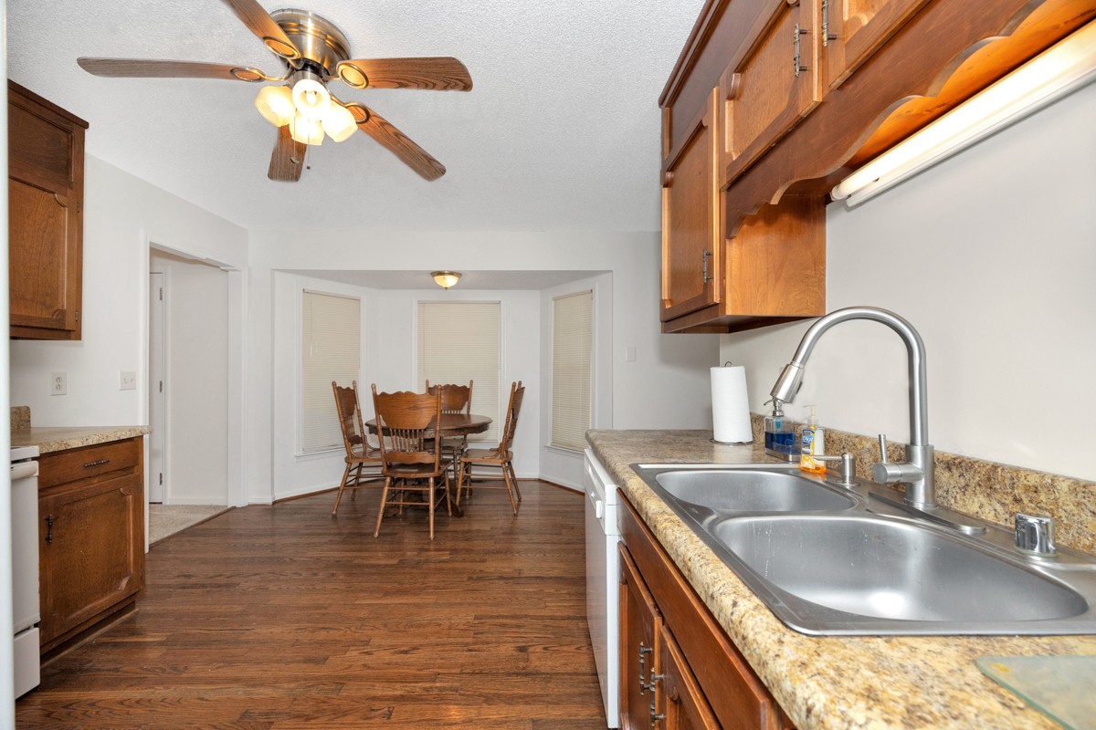 2134 Ready Section Road Toney, AL 35773 - Photo 17 of 35 a kitchen with kitchen island granite countertop a sink a counter top space and stainless steel appliances