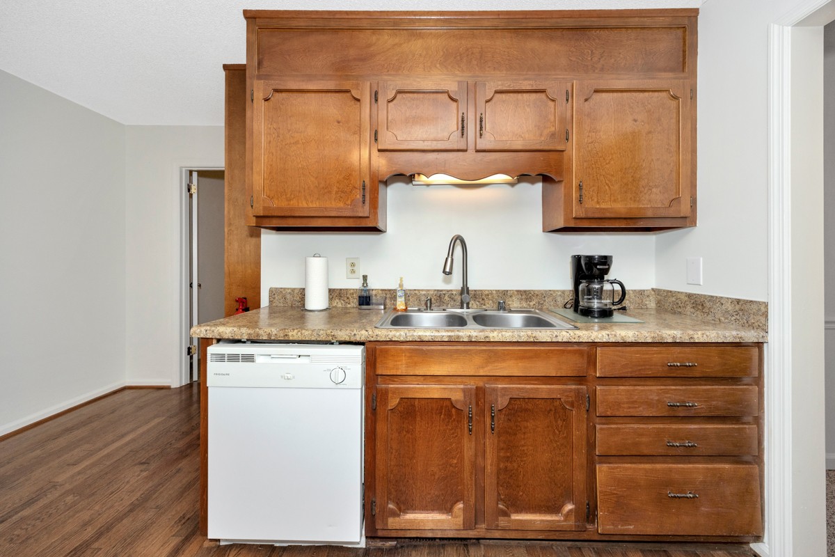 2134 Ready Section Road Toney, AL 35773 - Photo 19 of 35 a bathroom with a granite countertop sink a mirror and vanity