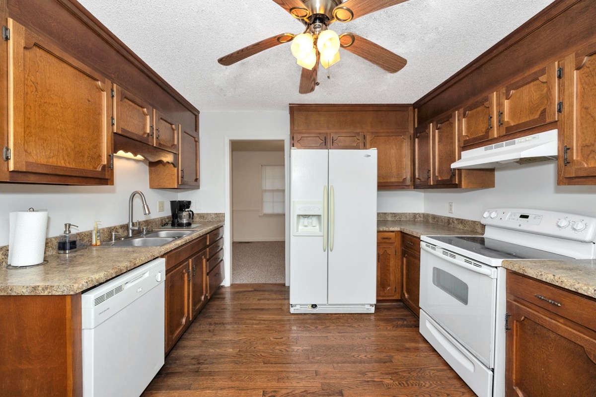 2134 Ready Section Road Toney, AL 35773 - Photo 20 of 35 a kitchen with stainless steel appliances granite countertop a sink stove and refrigerator