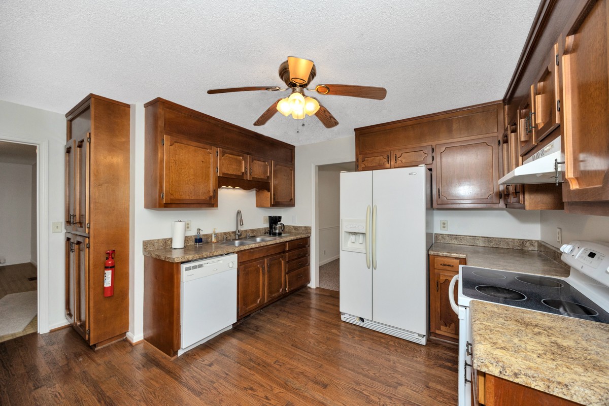 2134 Ready Section Road Toney, AL 35773 - Photo 22 of 35 a kitchen with stainless steel appliances granite countertop a refrigerator a stove a sink and dishwasher