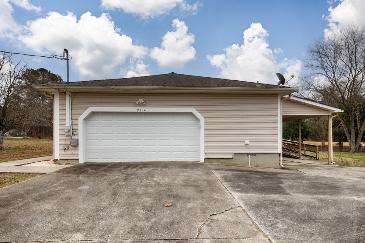 2134 Ready Section Road Toney, AL 35773 - Photo 6 of 35 a view of a house with a yard and garage