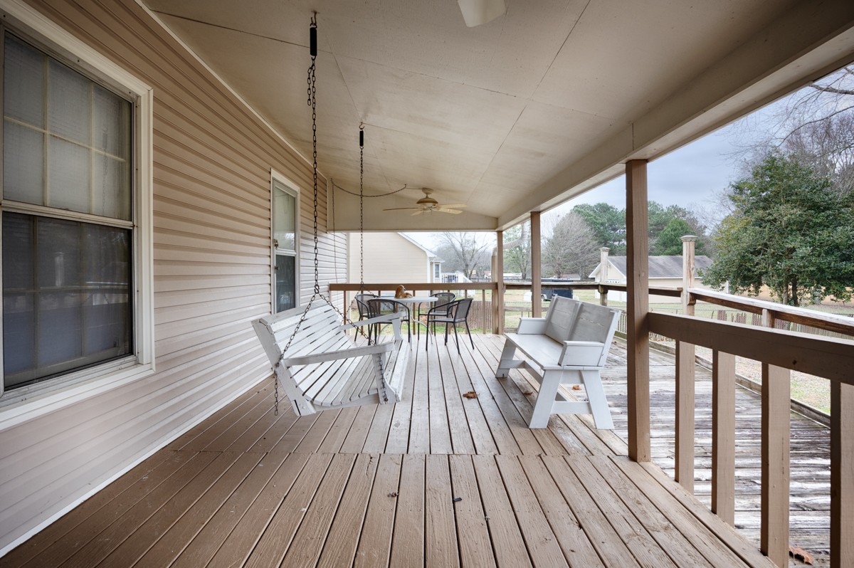 2134 Ready Section Road Toney, AL 35773 - Photo 9 of 35 a view of balcony with wooden floor and iron stairs