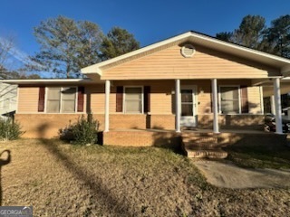 a front view of a house with garden