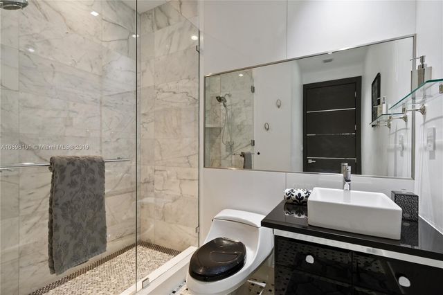 a kitchen with stainless steel appliances granite countertop a sink dishwasher stove and cabinets