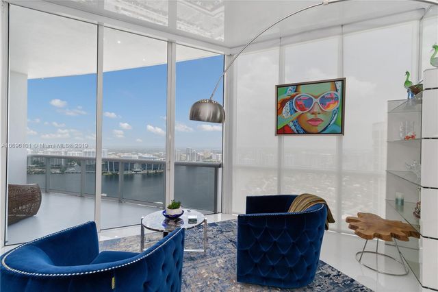 a bathroom with a toilet and a shower curtain