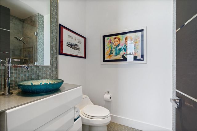 a view of a dining room with furniture and a window