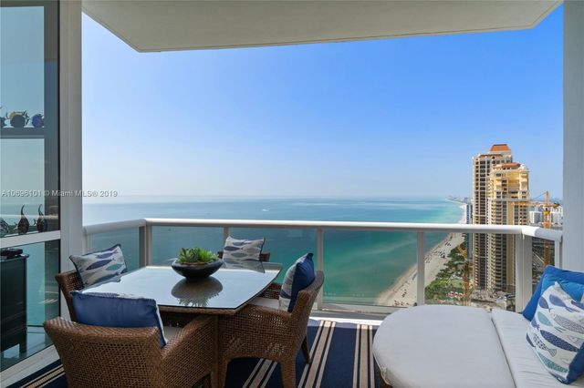 a view of roof deck with furniture