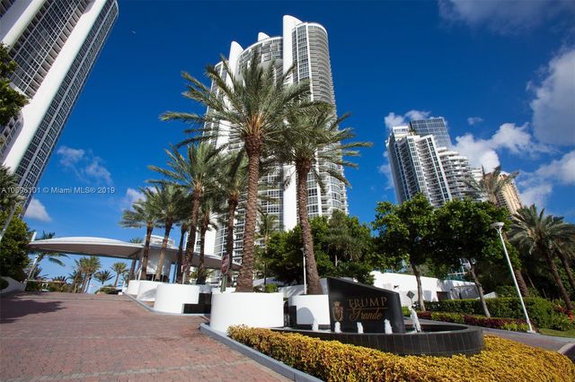 a backyard of a house with outdoor seating
