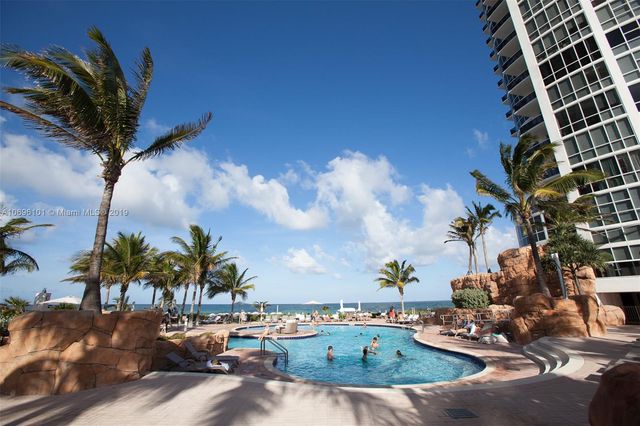 a view of a building with a yard